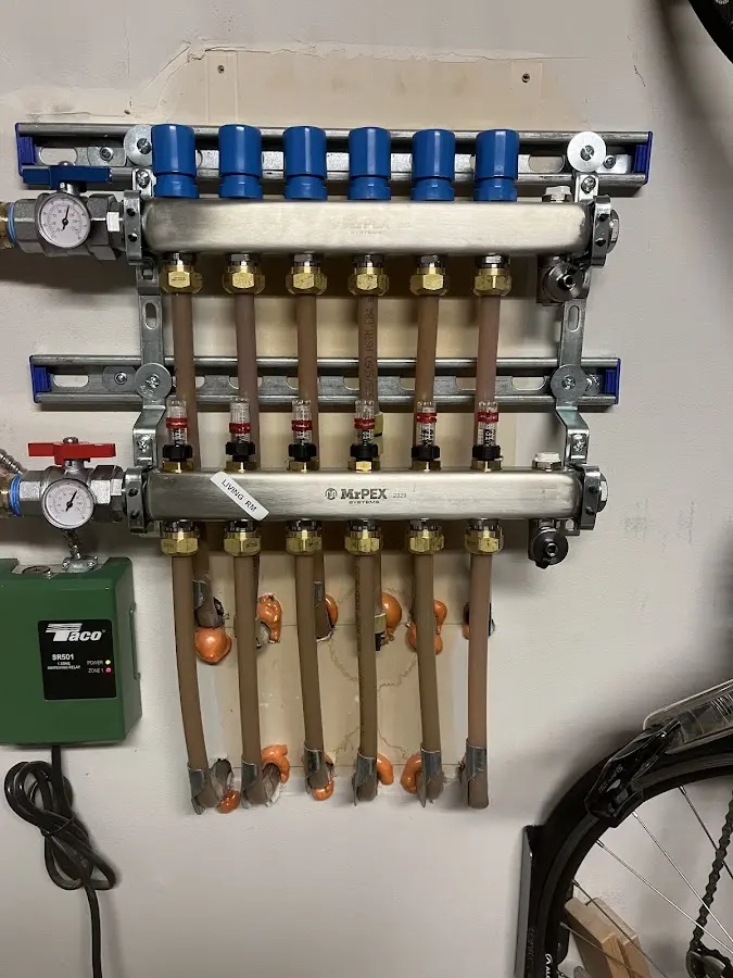 Plumber performing Water Heater Repair at a residential property in Ranson corporation